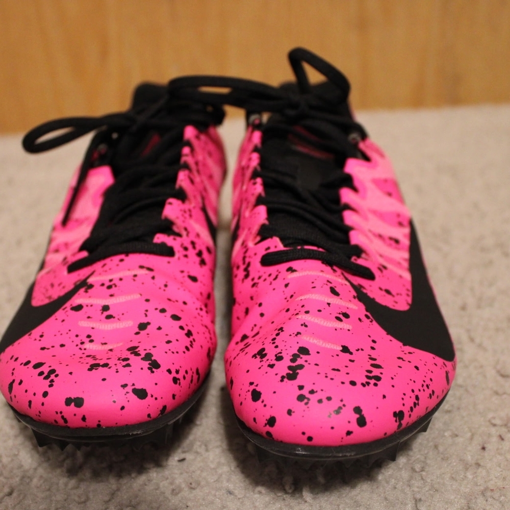 Nike Zoom Rival S 9 track spikes in the "Pink Blast" or "Paint Splatter"